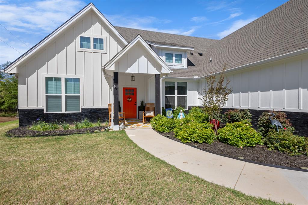 116 Lindsey Lane Runaway Bay, TX 76426 - Photo 3 of 35 a front view of a house with a yard