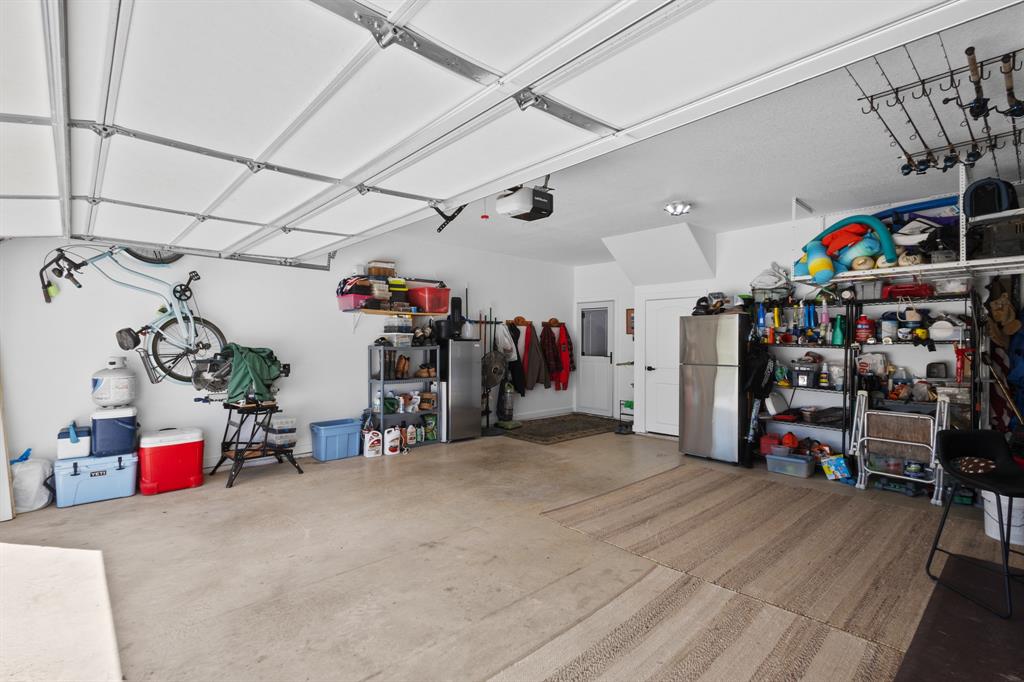 116 Lindsey Lane Runaway Bay, TX 76426 - Photo 35 of 35 a view of a storage room with a lot of stuff