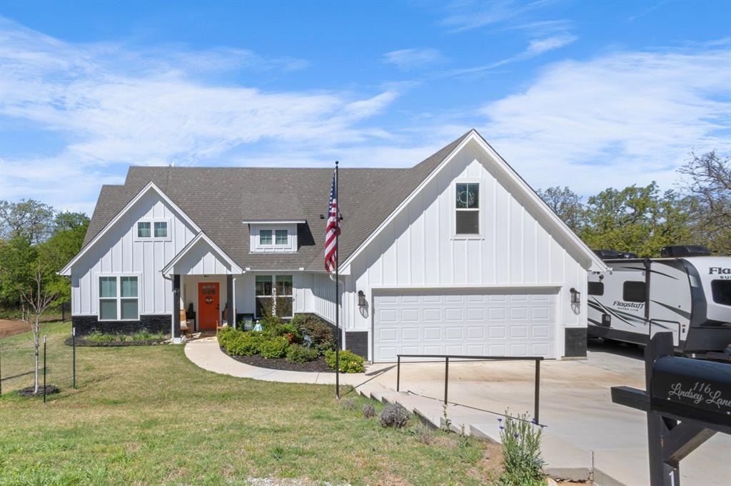 116 Lindsey Lane Runaway Bay, TX 76426 - Photo 4 of 35 front view of house with a yard
