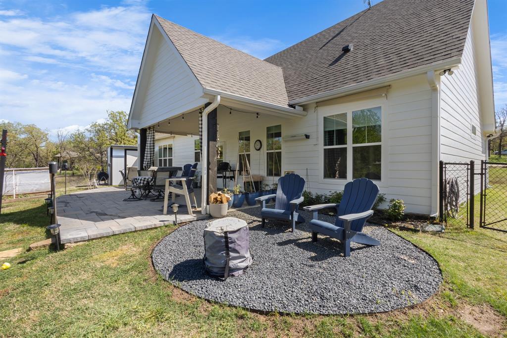 116 Lindsey Lane Runaway Bay, TX 76426 - Photo 6 of 35 a view of a house with backyard porch and sitting area