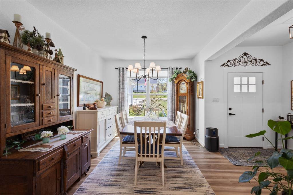 116 Lindsey Lane Runaway Bay, TX 76426 - Photo 9 of 35 a view of a dining room with furniture window and wooden floor