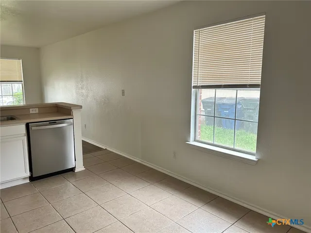 an empty room with windows