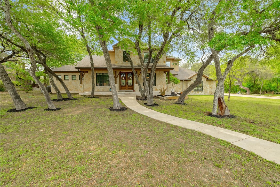 133 Waterford Lane Georgetown, TX 78628 - Photo 1 of 1 a view of a house with backyard and tree