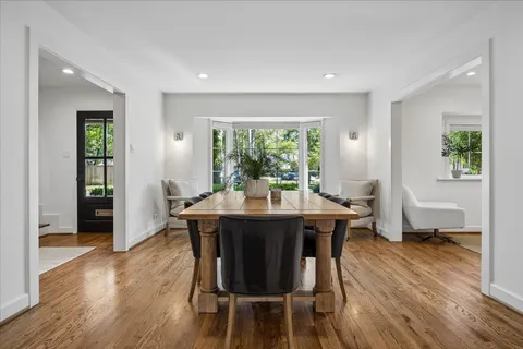 a view of a dining room with furniture window and wooden floor