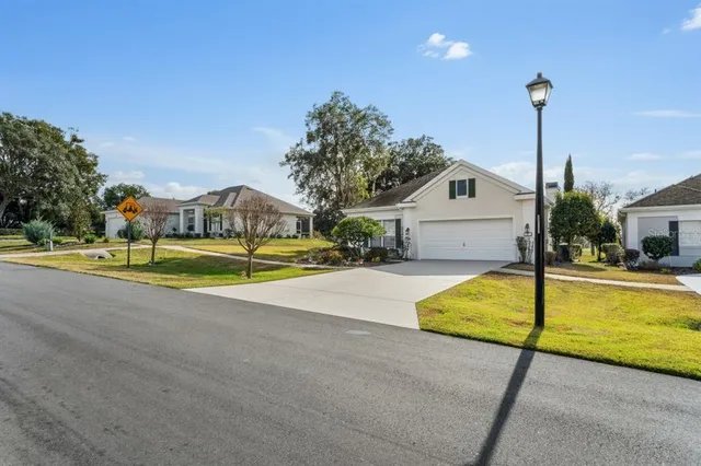 a view of a swimming pool with a house in the background