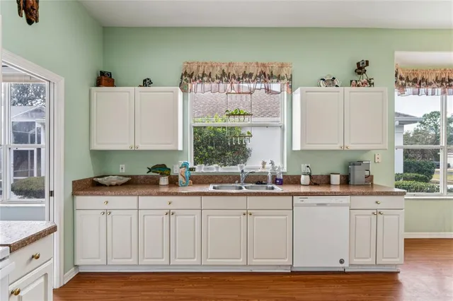 a bathroom with a bathtub a sink and a mirror