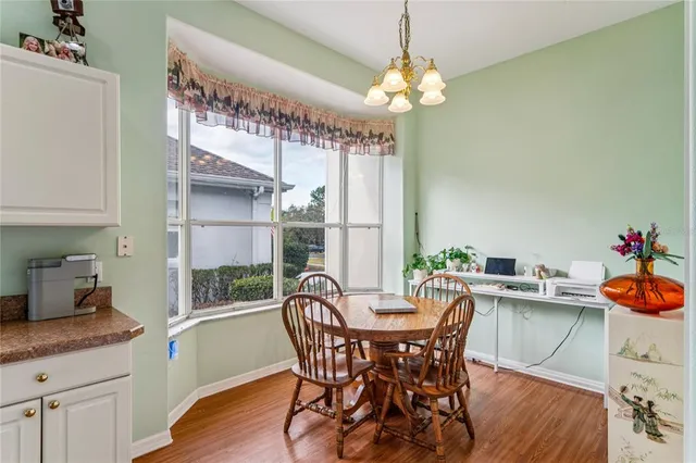 a bathroom with a granite countertop sink mirror and bathtub