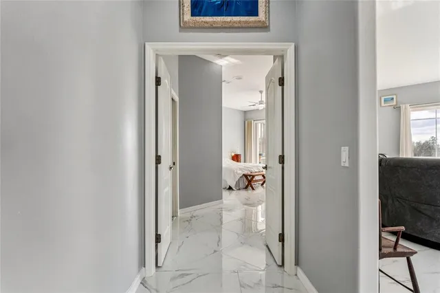 a bathroom with a shower and a glass door