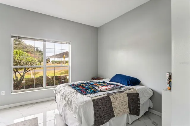a view of a swimming pool with a house in the background