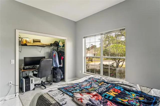 a view of a house with swimming pool and a yard