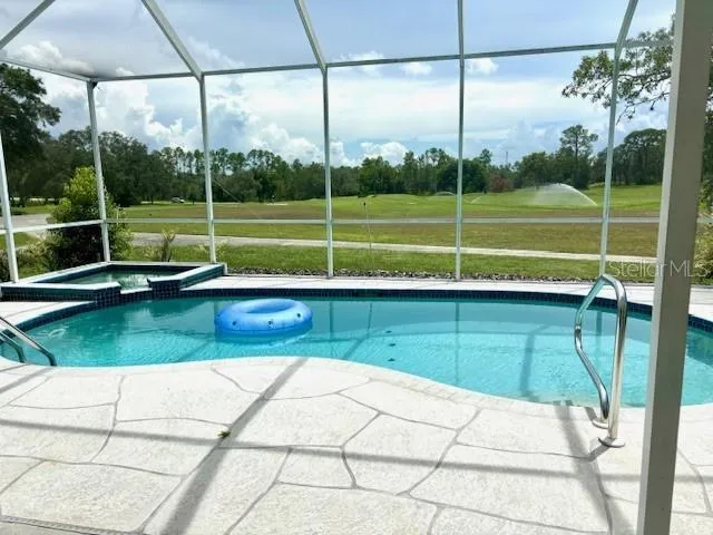 a front view of a house with swimming pool