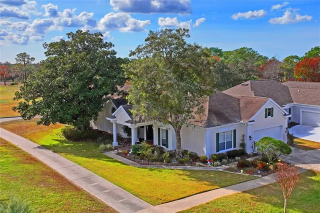 a front view of a house with a yard and porch