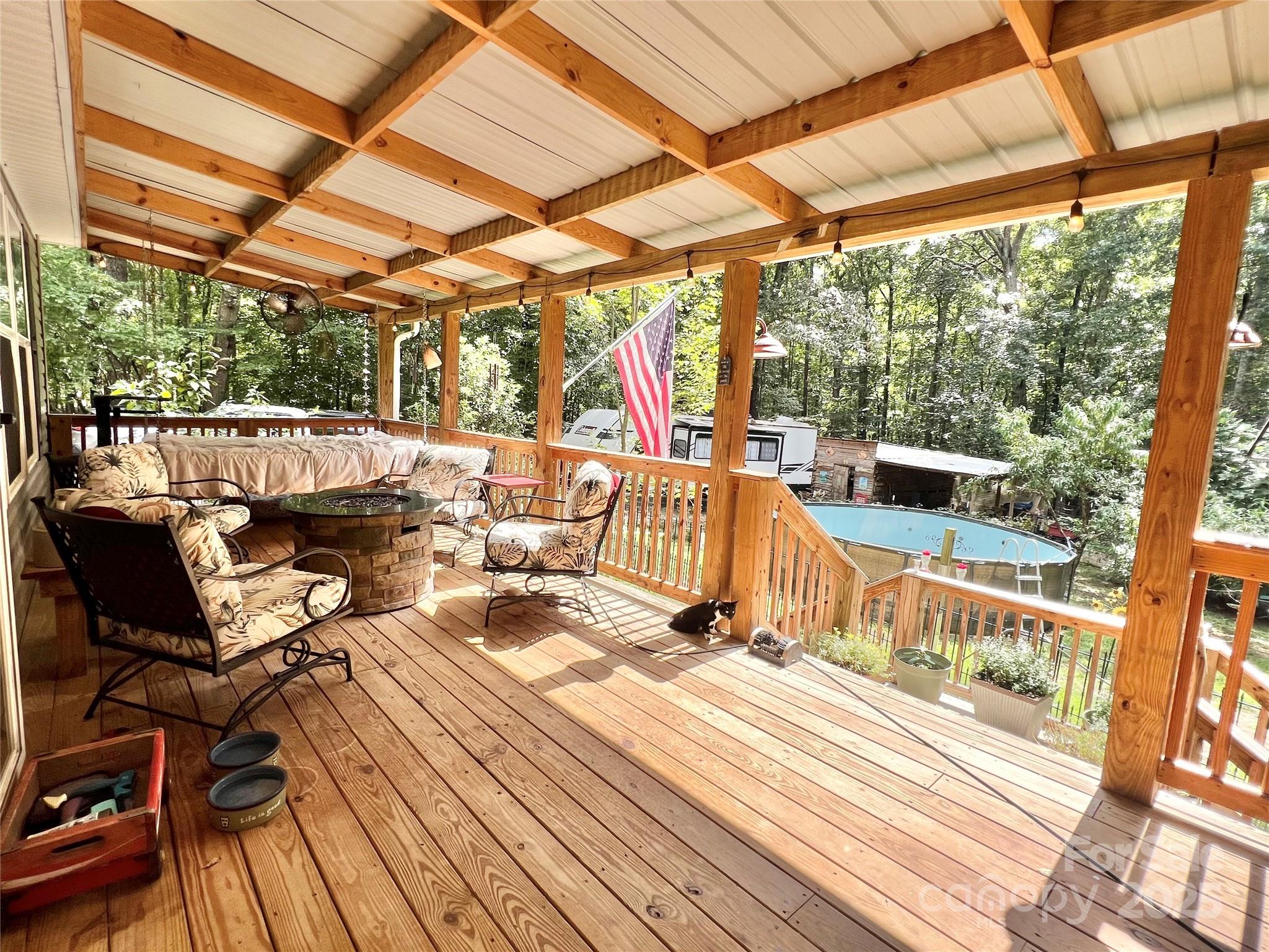 1258 Willis Road Chester, SC 29706 - Photo 17 of 32 a view of a patio with couches chairs and wooden floor