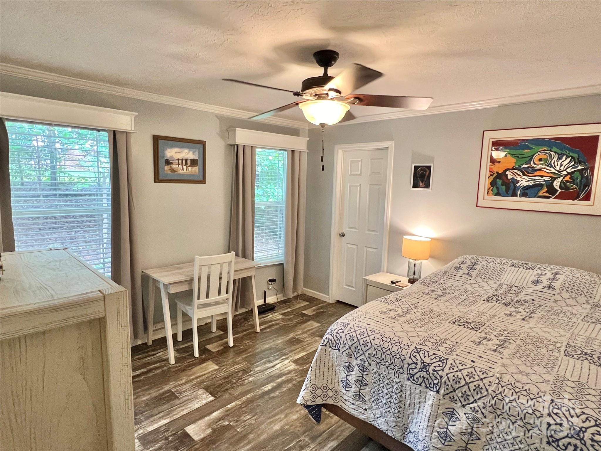 1258 Willis Road Chester, SC 29706 - Photo 7 of 32 a bedroom with a bed and a chandelier