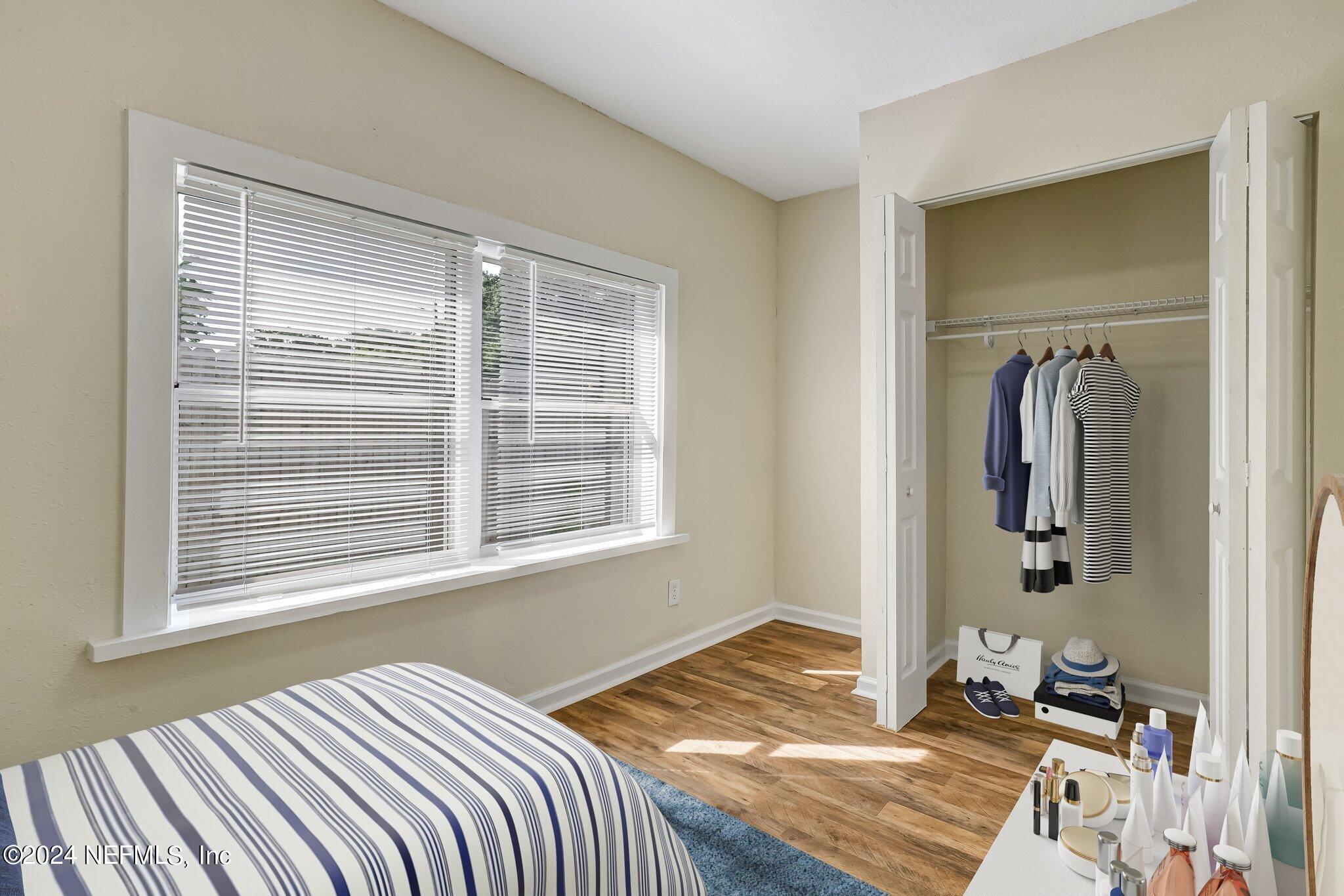 4917 Dundee Road Jacksonville, FL 32210 - Photo 16 of 26 a bedroom with a bed and a window