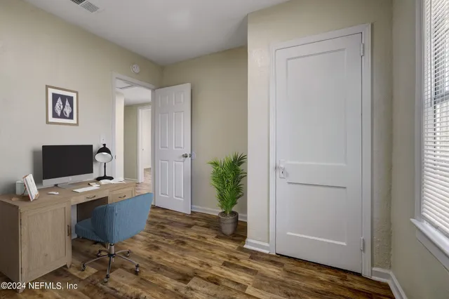 a workspace with furniture and window