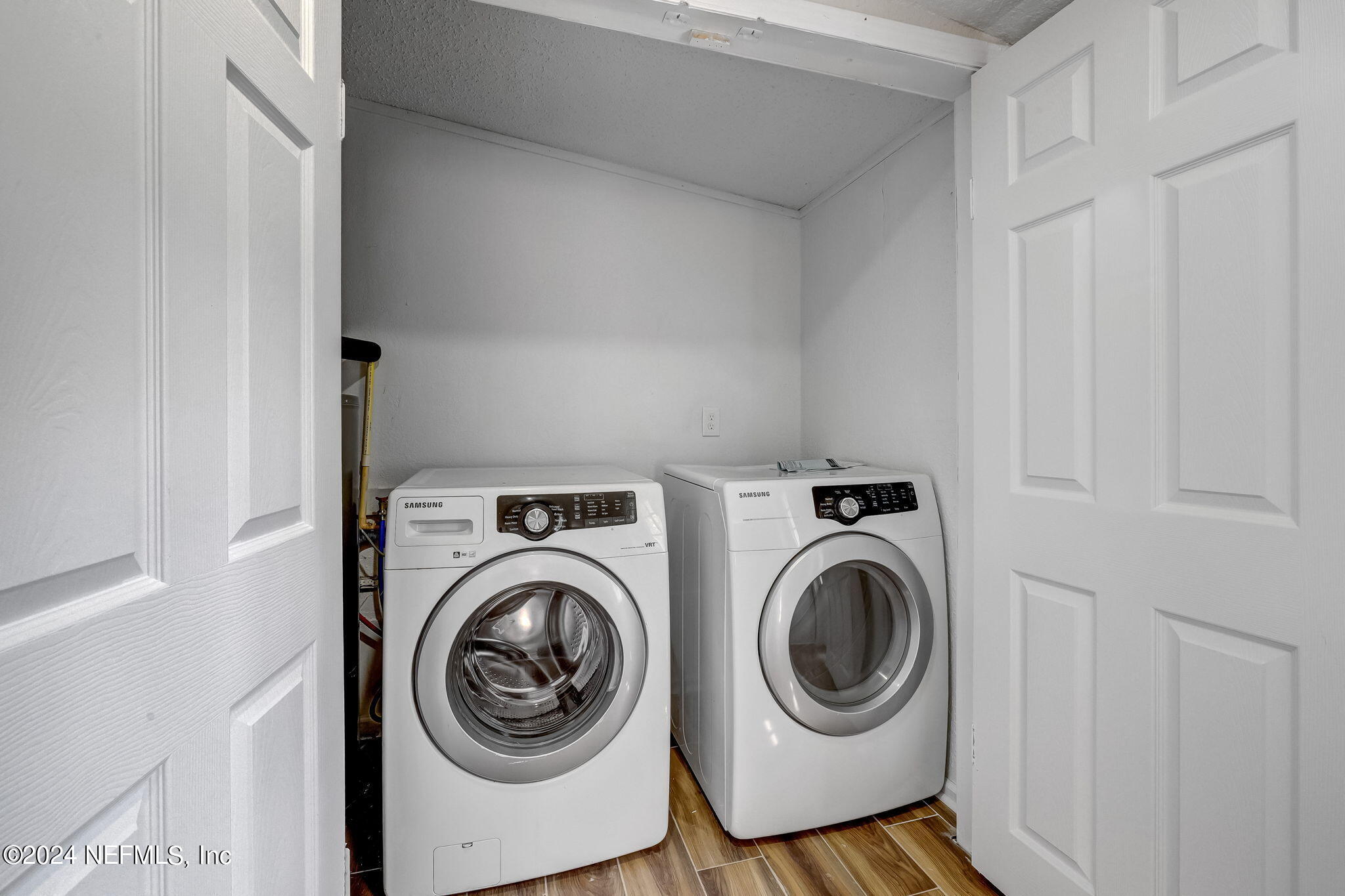 4917 Dundee Road Jacksonville, FL 32210 - Photo 21 of 26 a utility room with dryer and washer