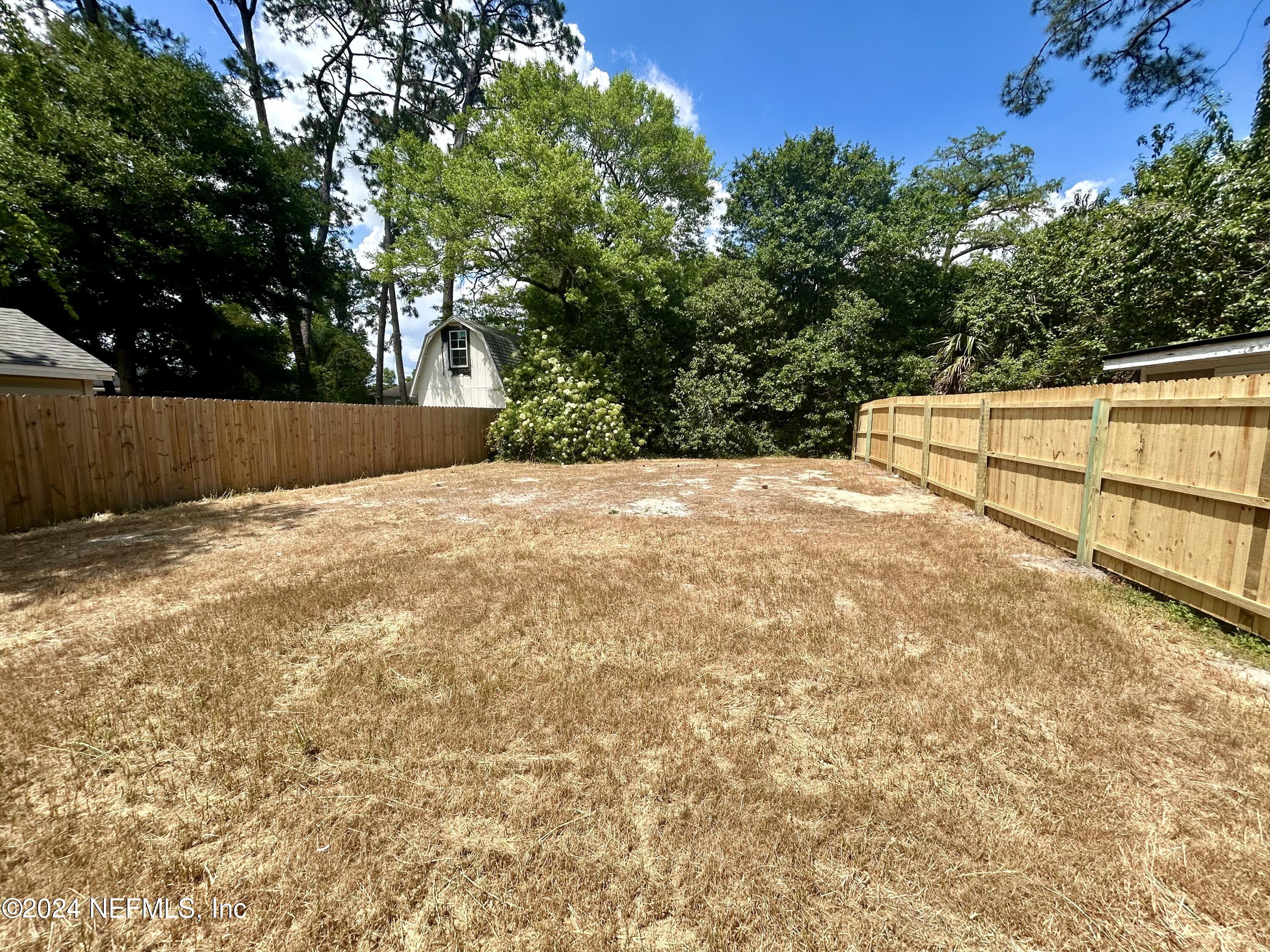 4917 Dundee Road Jacksonville, FL 32210 - Photo 25 of 26 a view of a backyard