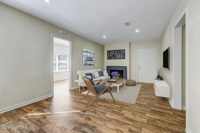 a living room with furniture and a fireplace