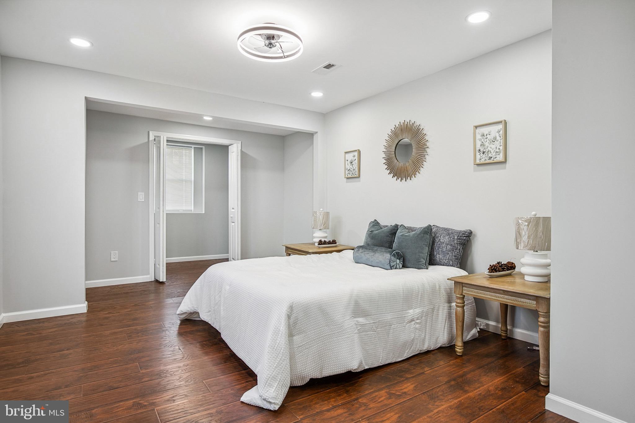 2501 North Point Road Dundalk, MD 21222 - Photo 14 of 28 a bedroom with a bed and a table
