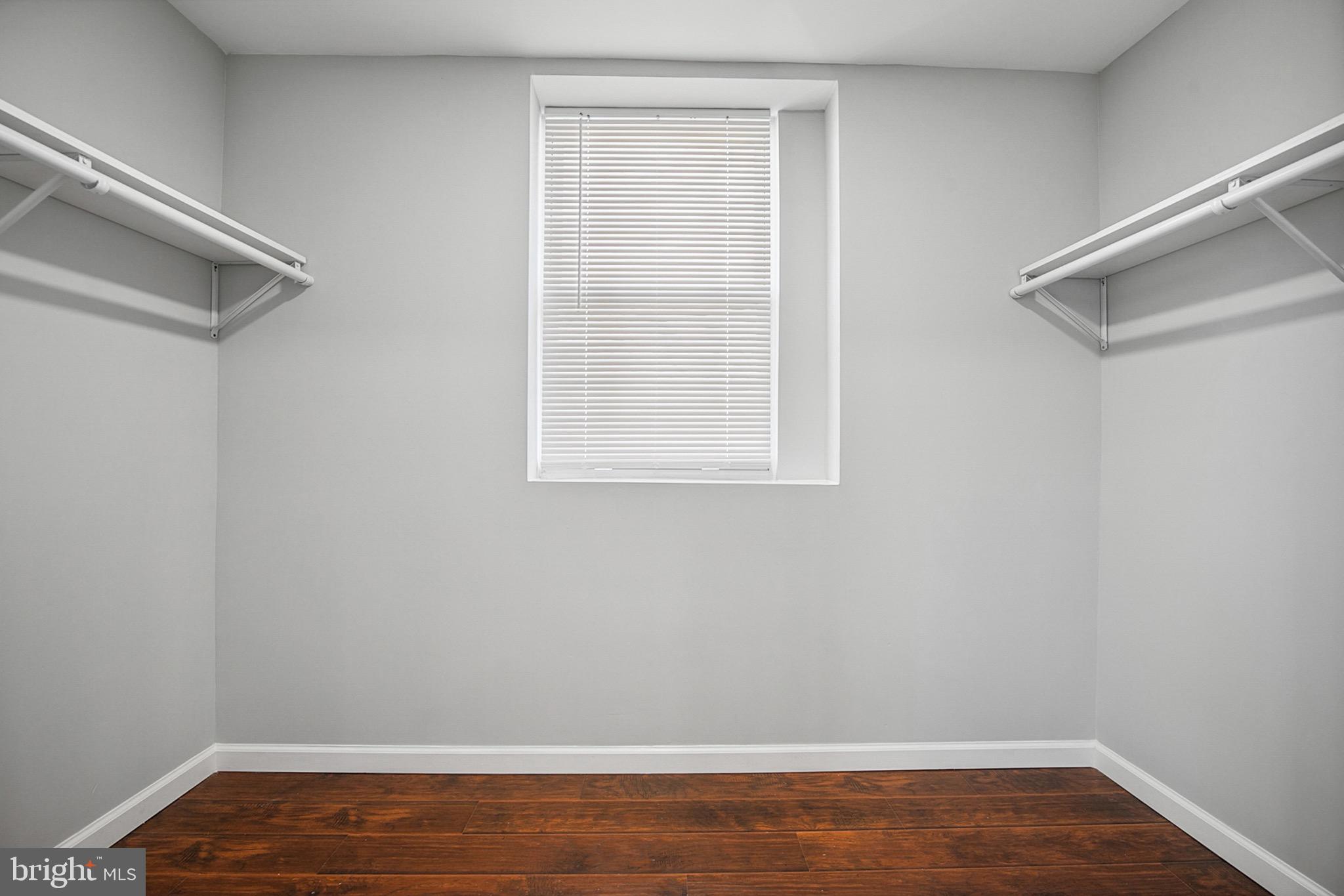 2501 North Point Road Dundalk, MD 21222 - Photo 15 of 28 a view of an empty room with wooden floor and a window