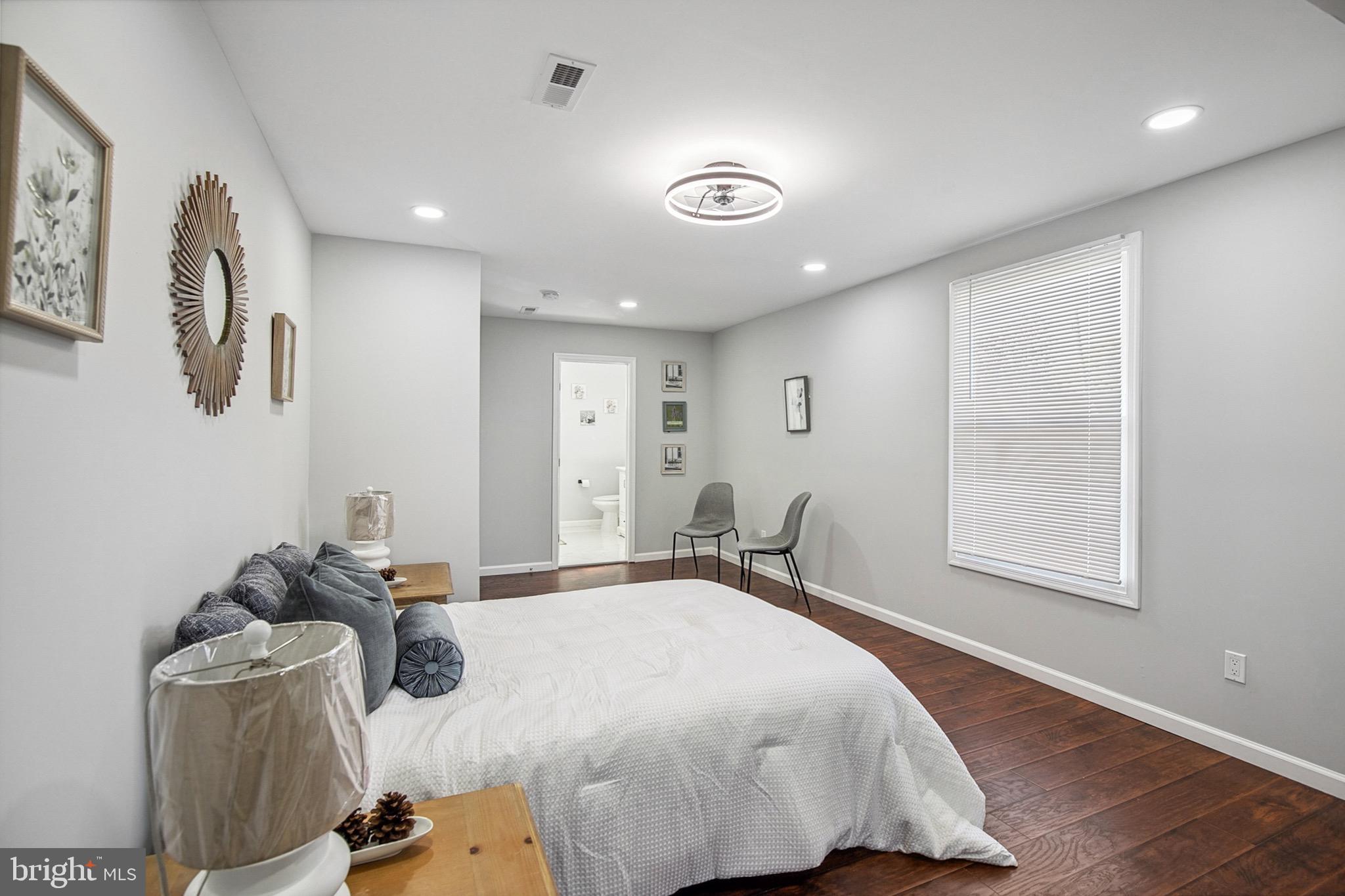 2501 North Point Road Dundalk, MD 21222 - Photo 17 of 28 a bedroom with a bed and a window