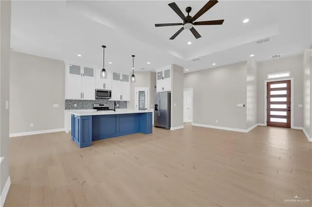 an aerial view of multiple houses with yard