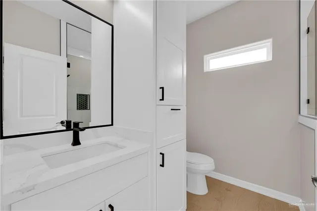 a bathroom with a sink and mirror