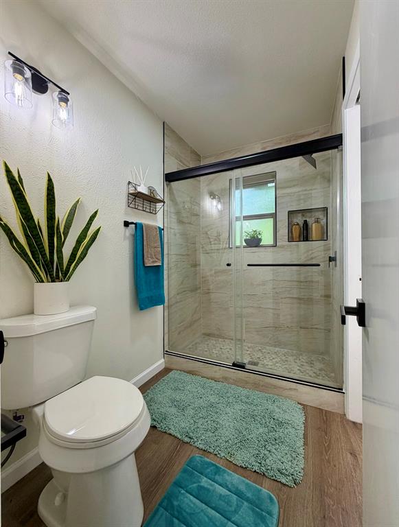 3609 Country Club Road Arlington, TX 76013 - Photo 25 of 40 a bathroom with a toilet a sink and shower