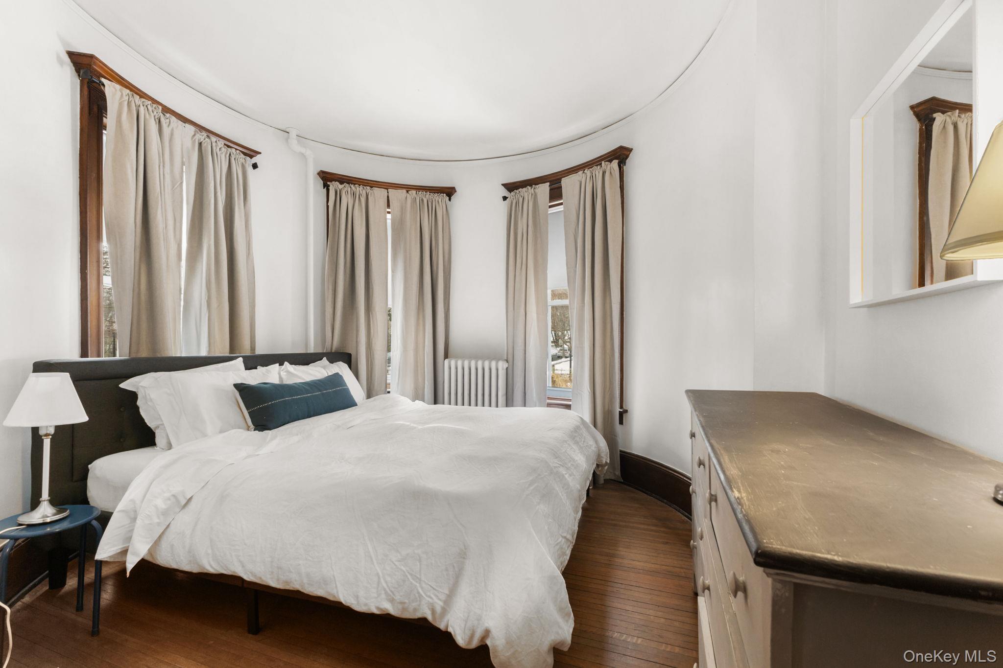 16 Bedford Road, Unit 1 Katonah, NY 10536 - Photo 5 of 10 a bedroom with a bed and a window