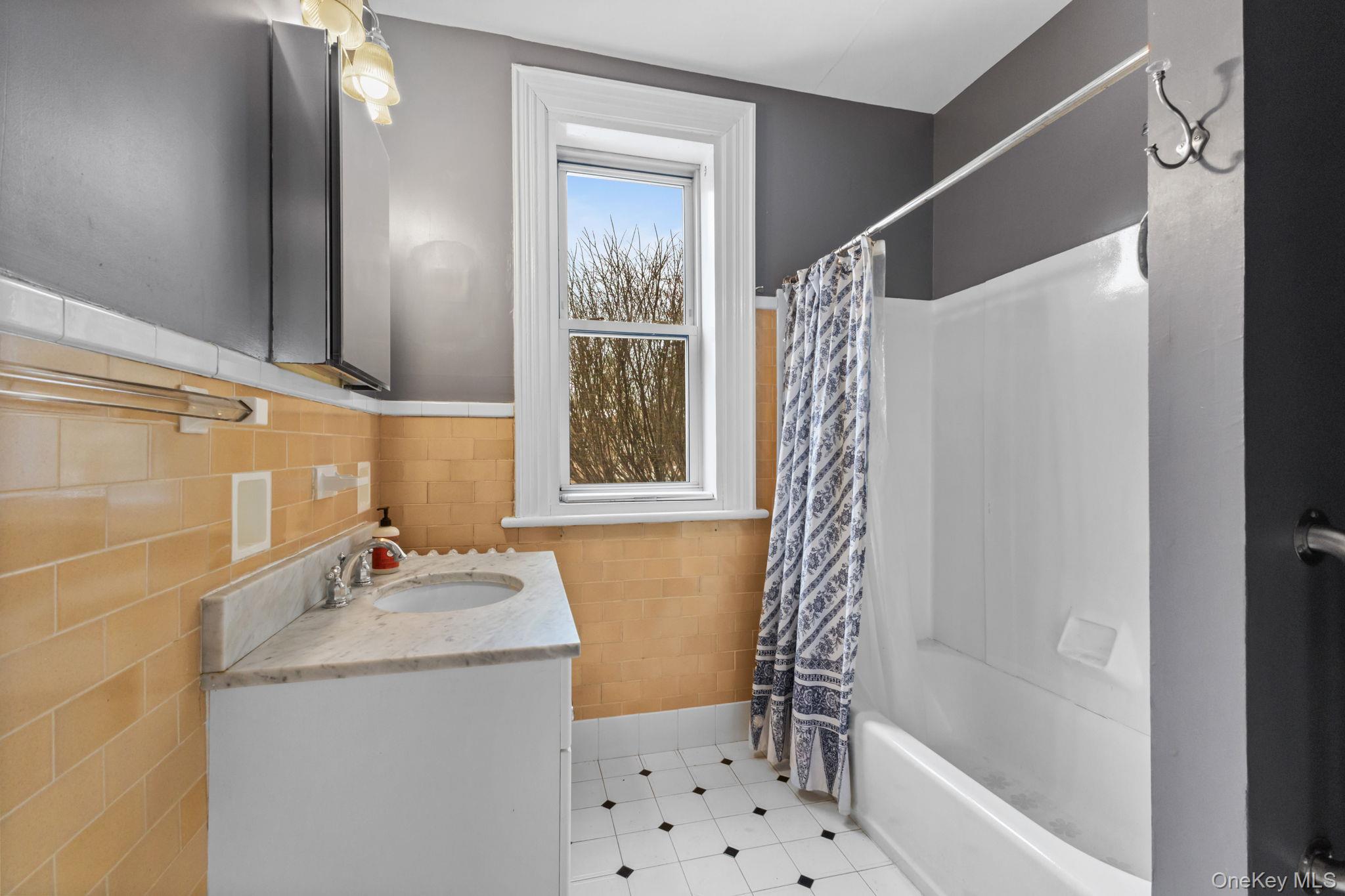 16 Bedford Road, Unit 1 Katonah, NY 10536 - Photo 9 of 10 a bathroom with a sink a toilet and shower