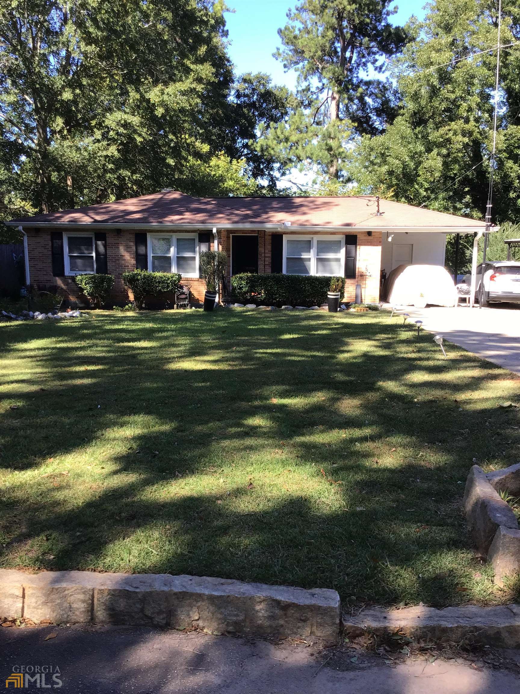 3218 Canary Court Decatur, GA 30032 - Photo 1 of 1 a front view of a house with a garden