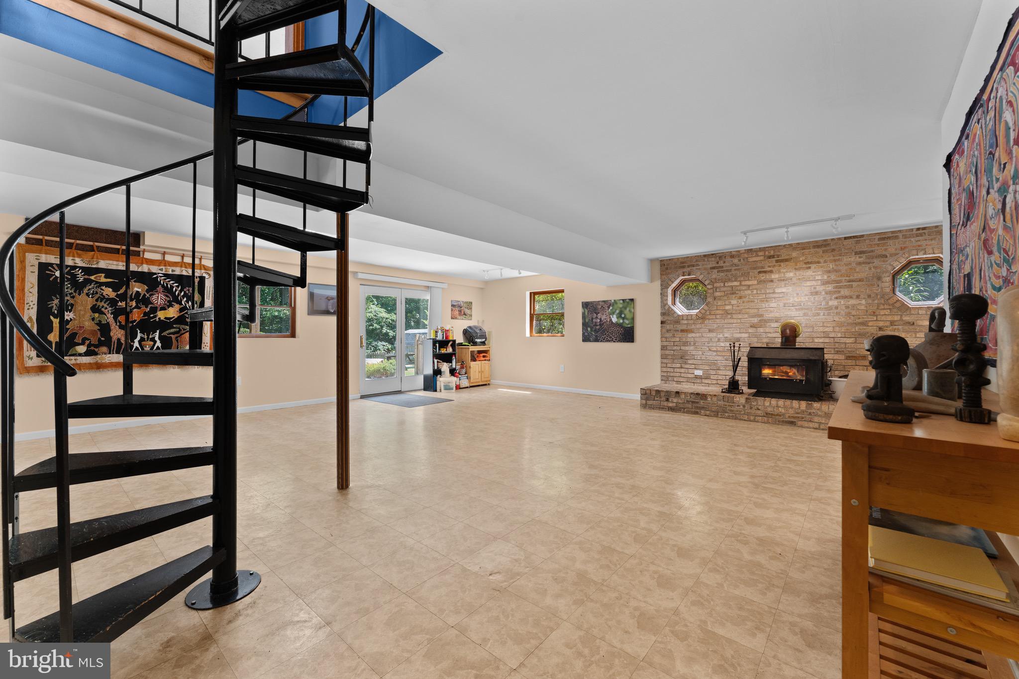 9600 Ritter Road Nokesville, VA 20181 - Photo 43 of 68 Lower-level entertainment area wi/spiral staircase