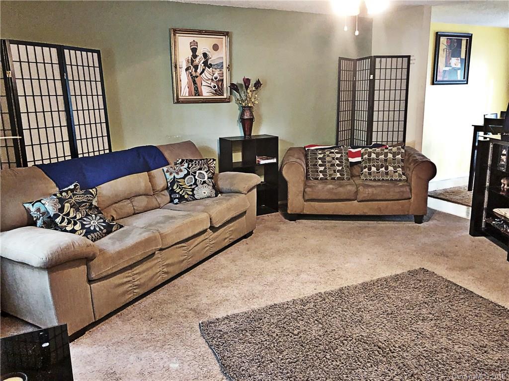 6637 Saddle Point Road Charlotte, NC 28212 - Photo 2 of 7 a living room with furniture window and a couch
