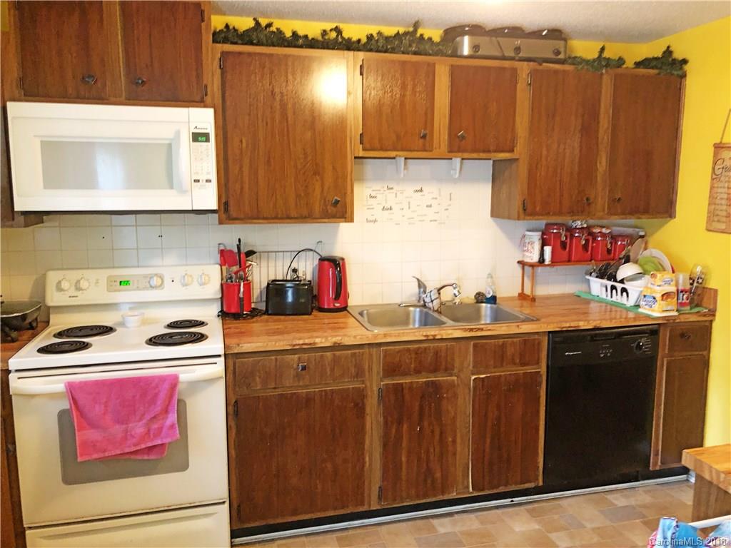 6637 Saddle Point Road Charlotte, NC 28212 - Photo 3 of 7 a kitchen with a sink cabinets and appliances