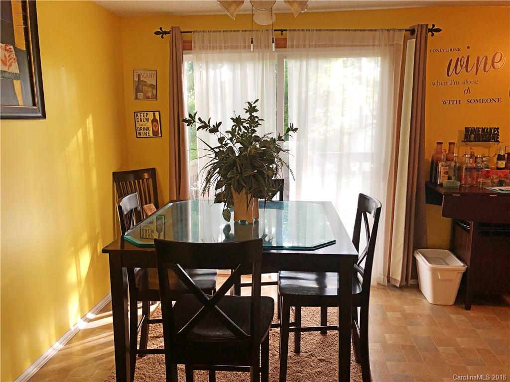 6637 Saddle Point Road Charlotte, NC 28212 - Photo 4 of 7 a view of a dining room with furniture and window