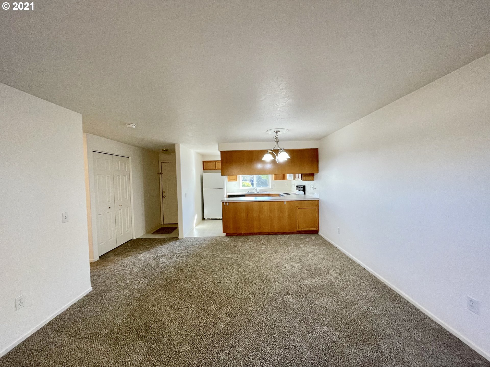 994 West L Street Springfield, OR 97477 - Photo 3 of 26 a view of a big room with cabinet and a flat screen tv