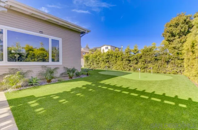 a view of a back yard of the house