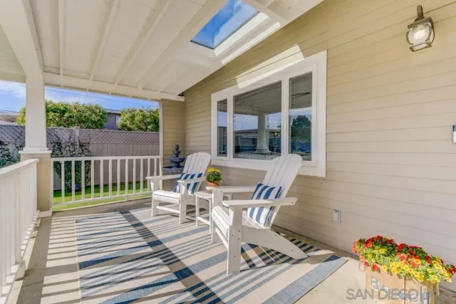 a view of a chair and tables back yard of the house