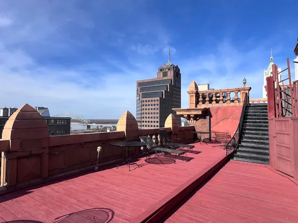 a view of a balcony with chairs