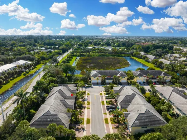 an aerial view of residential houses with outdoor space