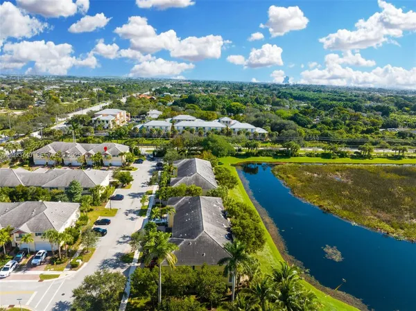 an aerial view of residential houses with outdoor space