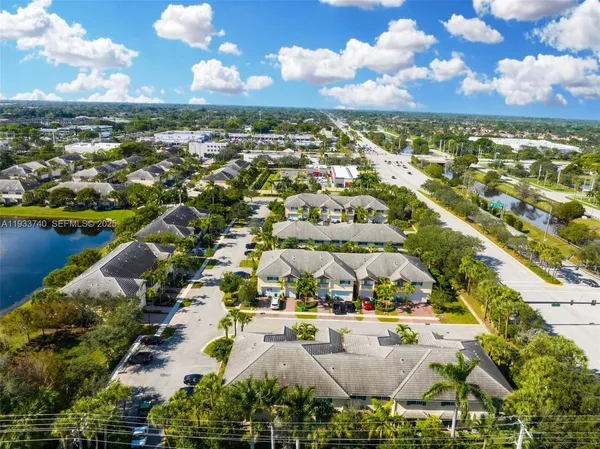 a view of a house with backyard porch and sitting area