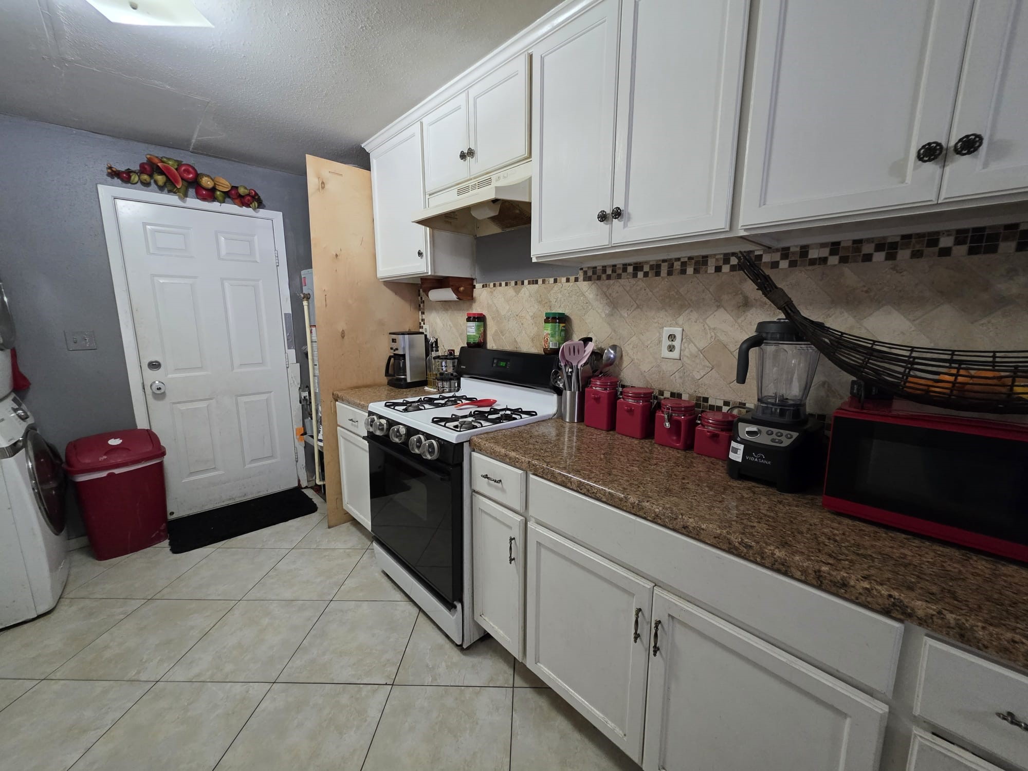2415 West Little York Road, Unit D Houston, TX 77091 - Photo 13 of 16 a kitchen with a sink and cabinets