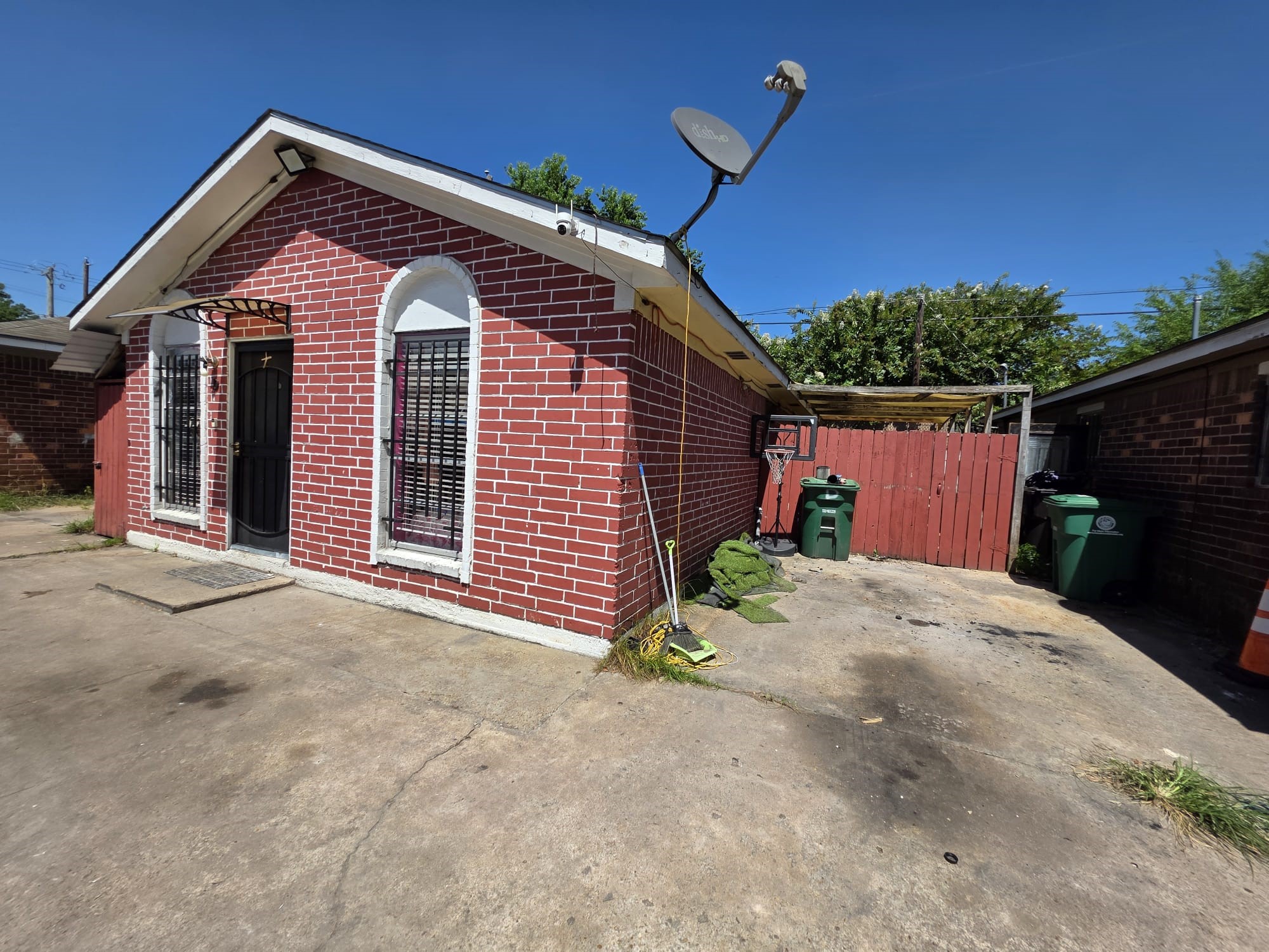 2415 West Little York Road, Unit D Houston, TX 77091 - Photo 2 of 16 a front view of a house with a yard and garage