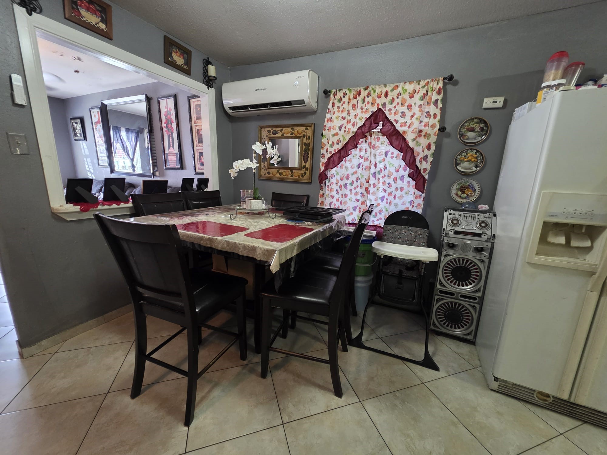 2415 West Little York Road, Unit D Houston, TX 77091 - Photo 9 of 16 a view of a dining room with furniture and a chandelier