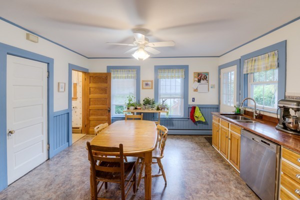 22 Havelock Road Worcester, MA 01602 - Photo 20 of 30 a kitchen with sink a stove and chairs
