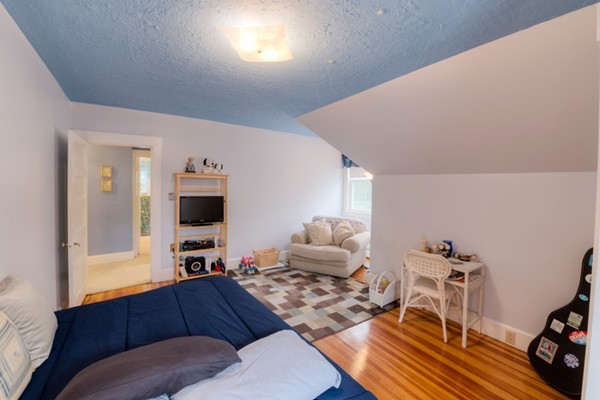22 Havelock Road Worcester, MA 01602 - Photo 27 of 30 a living room with furniture and a flat screen tv