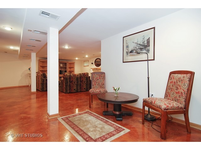 732 Selborne Road Riverside, IL 60546 - Photo 16 of 23 a living room with furniture and a table