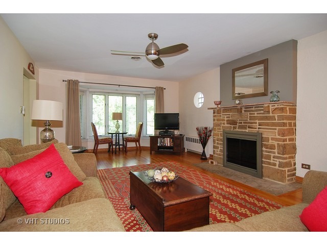 732 Selborne Road Riverside, IL 60546 - Photo 3 of 23 a living room with furniture and a fireplace